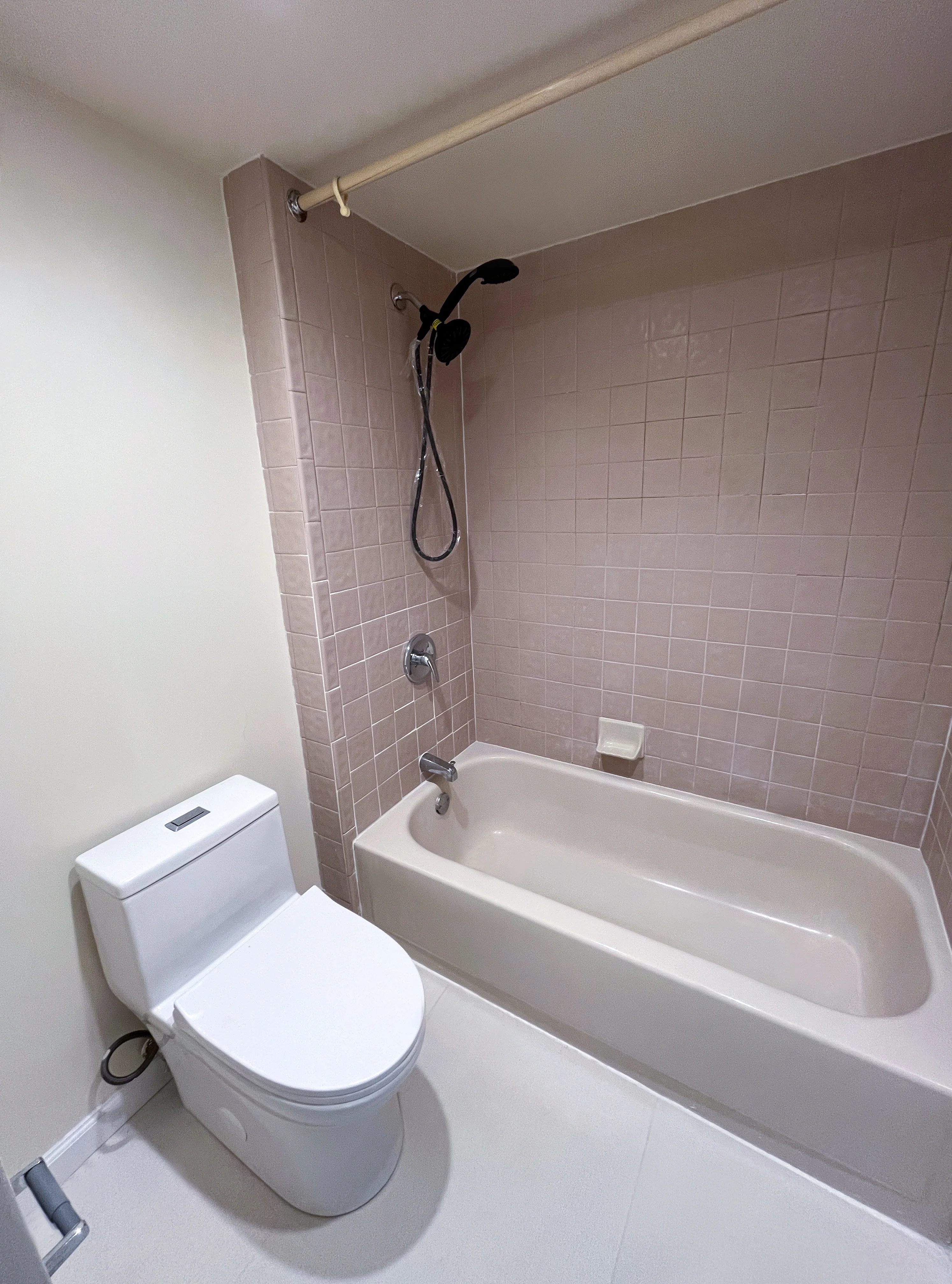 Private apartment bathroom with bathtub and shower
